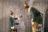Scene from Elf the movie, poppa elf showing buddy the elf a photo.